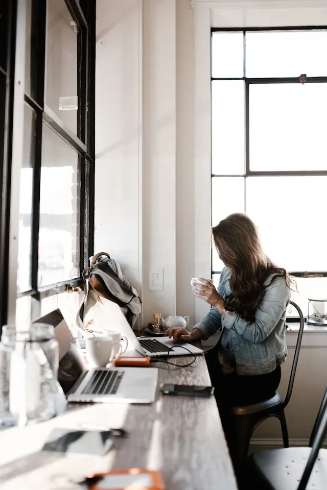 Woman at desk using a computer